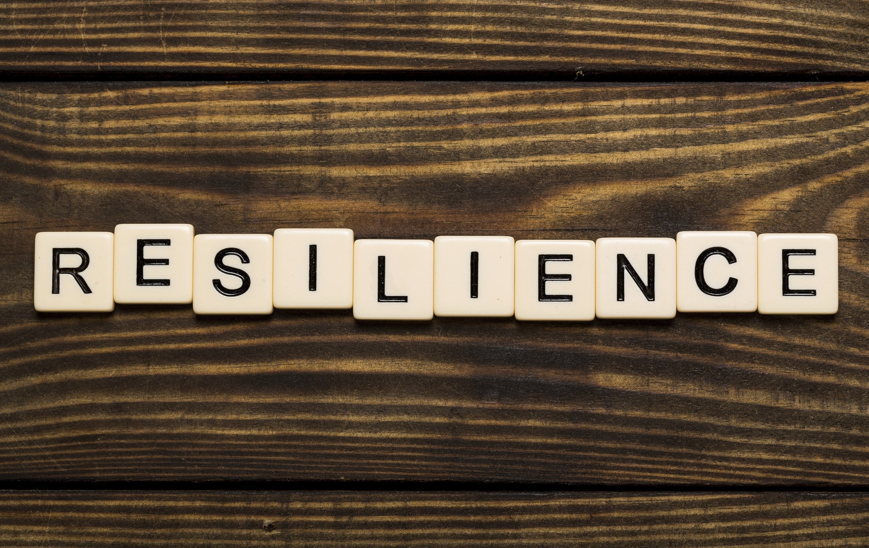 the word Resilience spelt using Scrabble letters