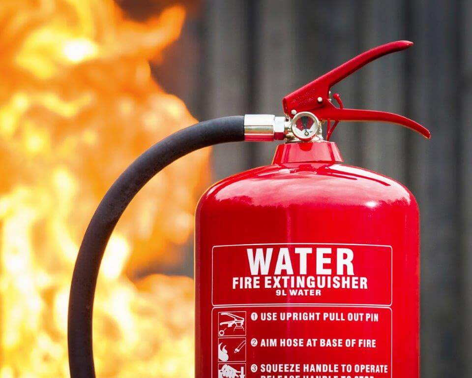 water fire extinguisher with flames in background